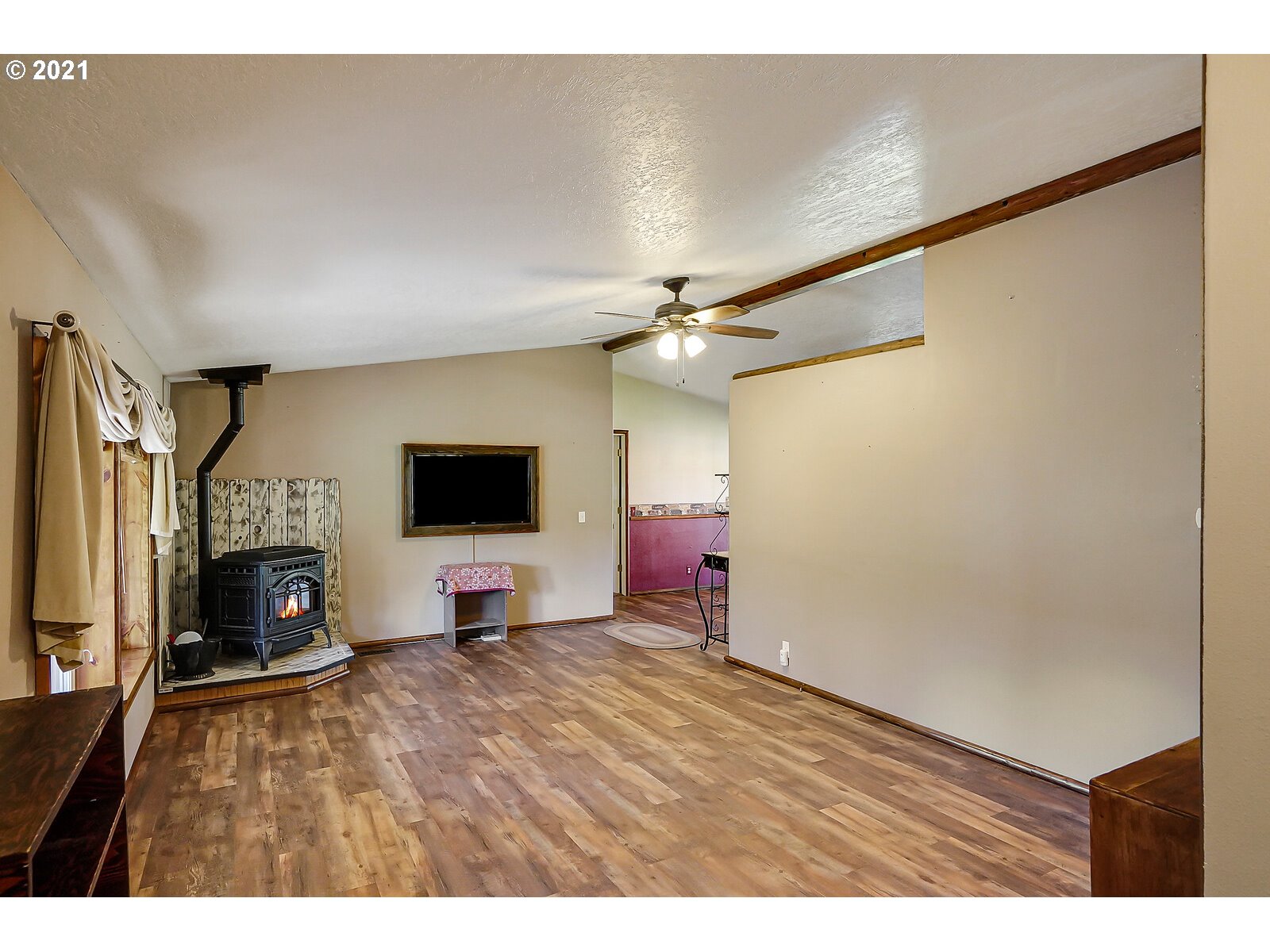 1725 Main Street Lyons, OR 97358 - Photo 7 of 32 a living room with furniture and a flat screen tv