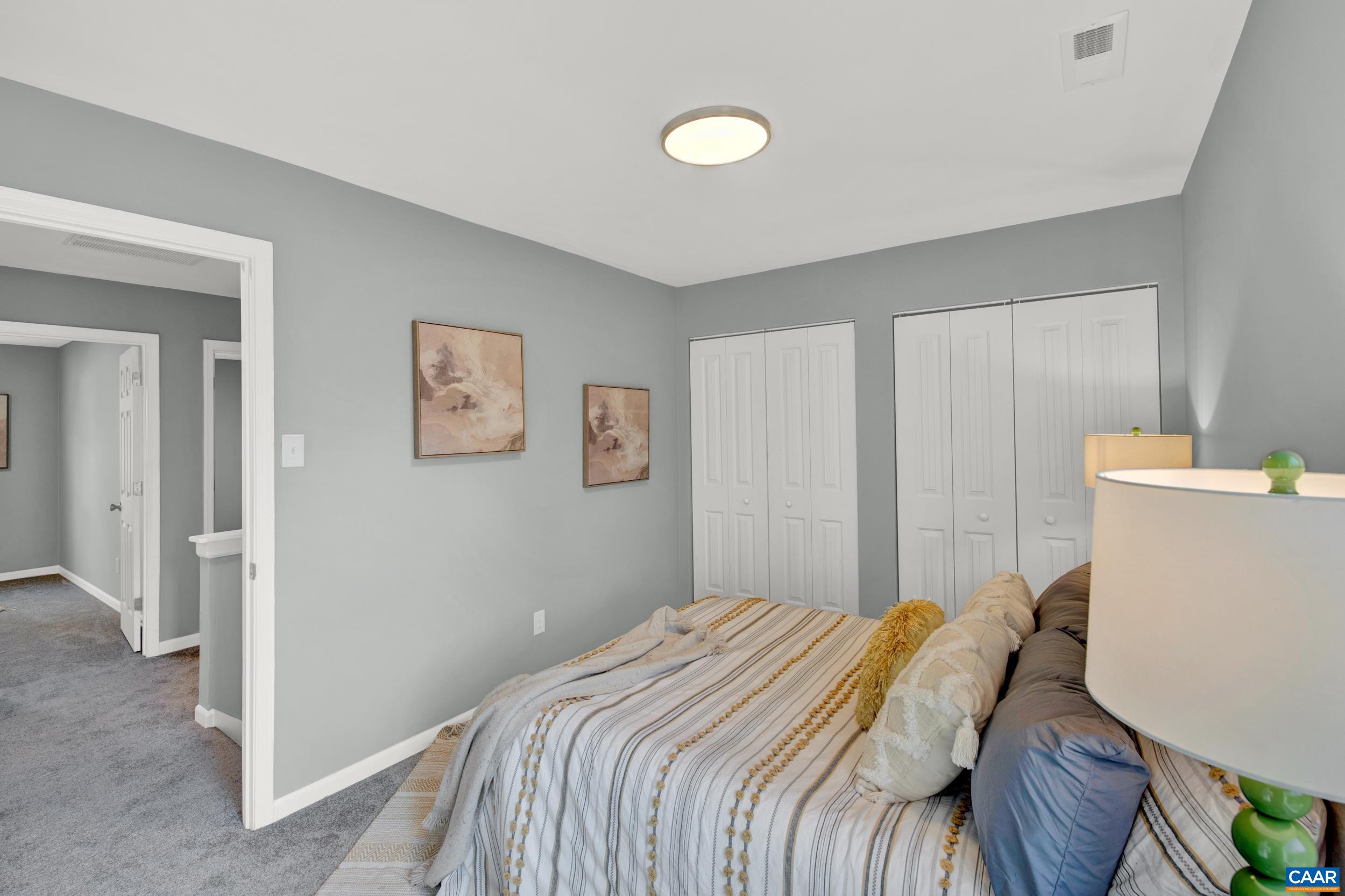 1100 West Daffodil Road Ruckersville, VA 22968 - Photo 19 of 27 a bedroom with a bed and a couch