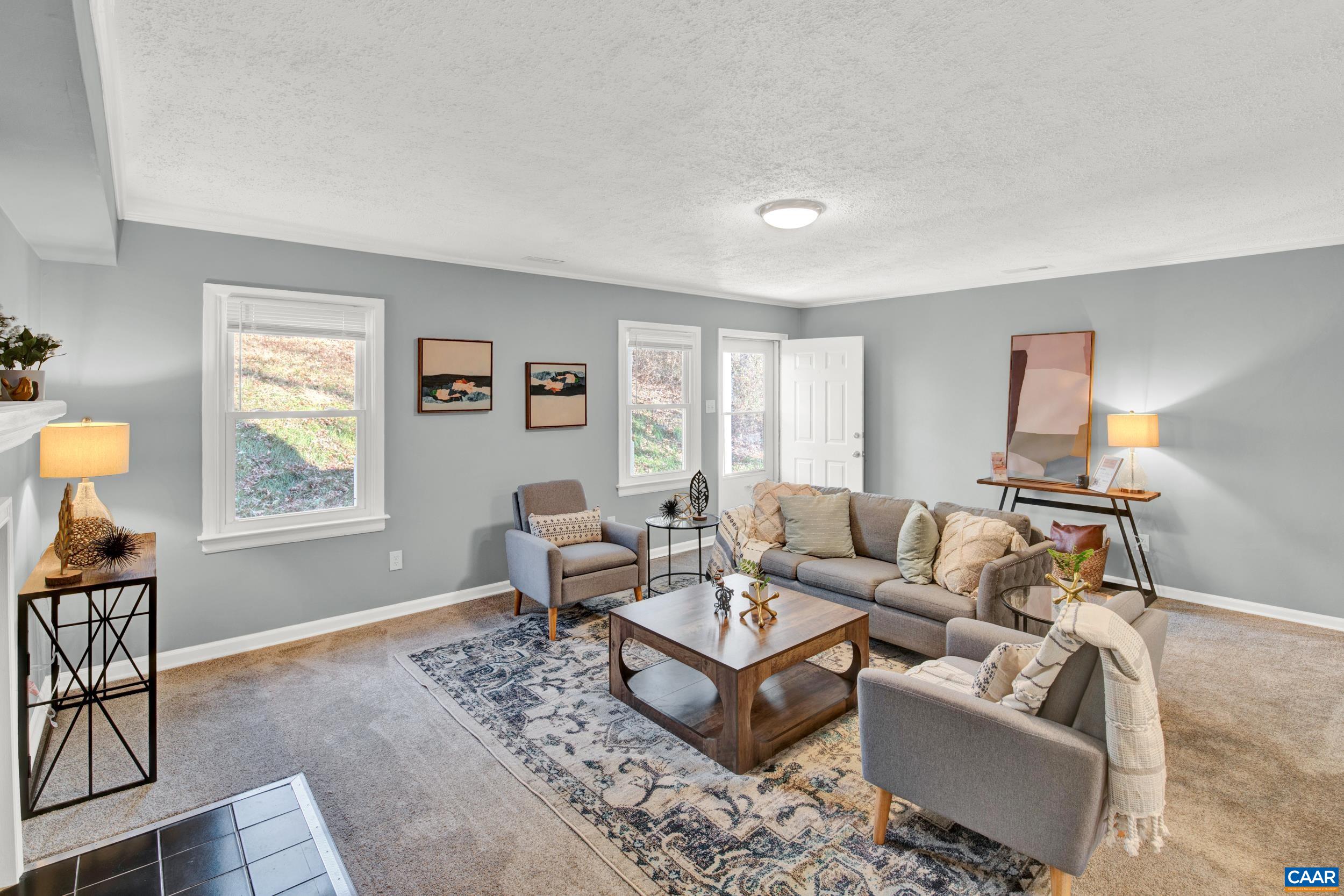 1100 West Daffodil Road Ruckersville, VA 22968 - Photo 5 of 27 a living room with furniture and a window