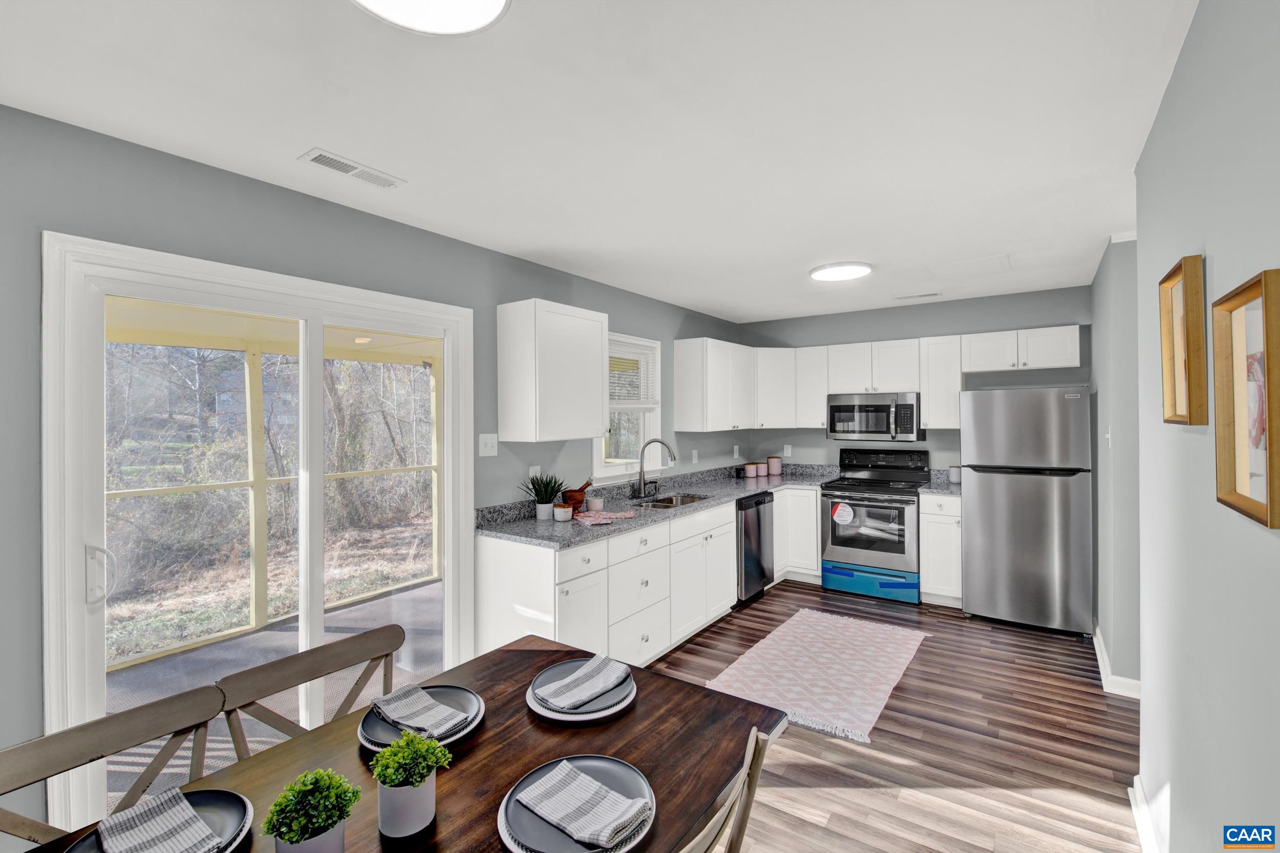1100 West Daffodil Road Ruckersville, VA 22968 - Photo 7 of 27 a kitchen with a refrigerator and a stove top oven
