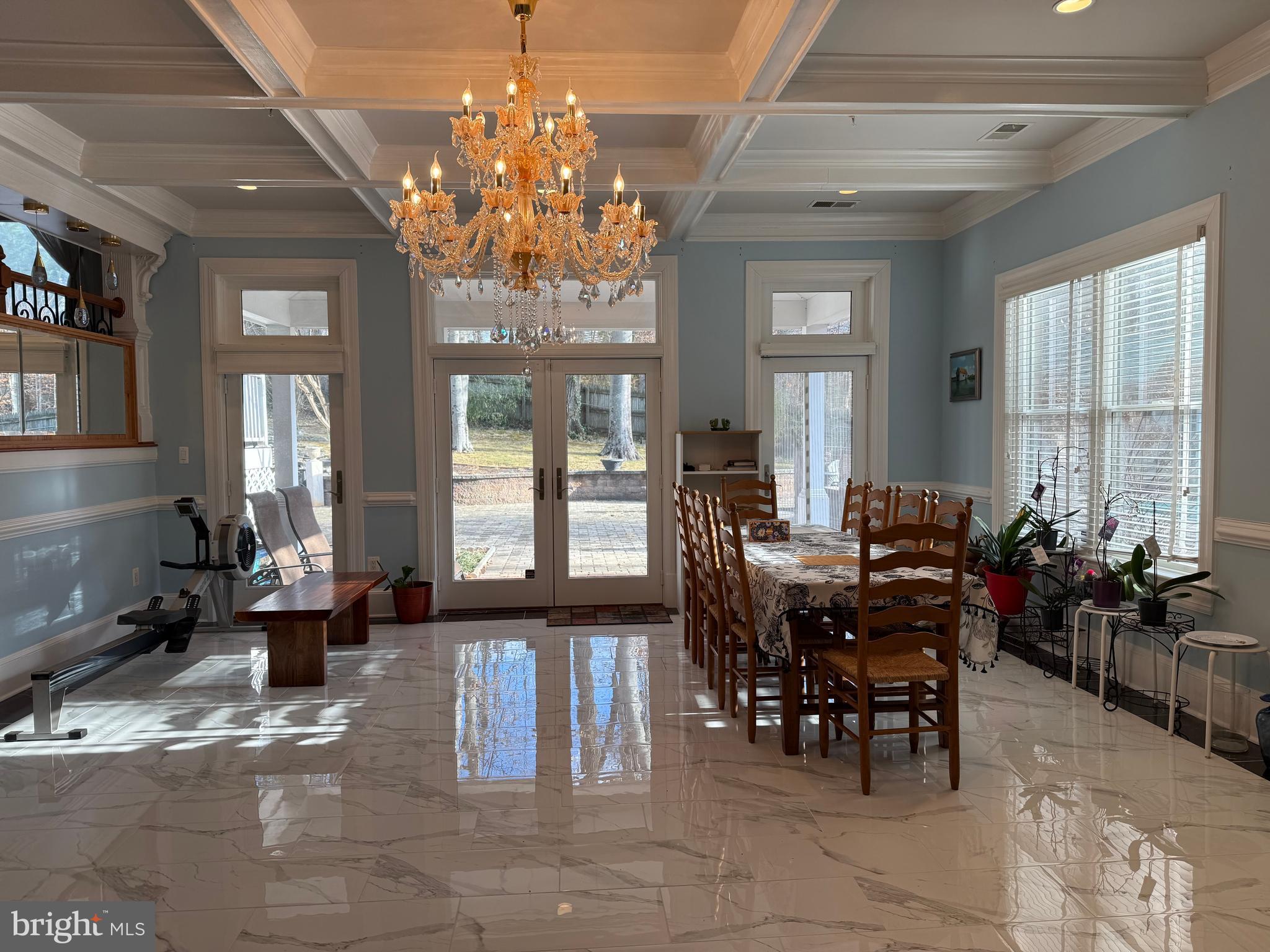 8505 Howell Road Bethesda, MD 20817 - Photo 5 of 11 a view of a dining room with furniture and a chandelier