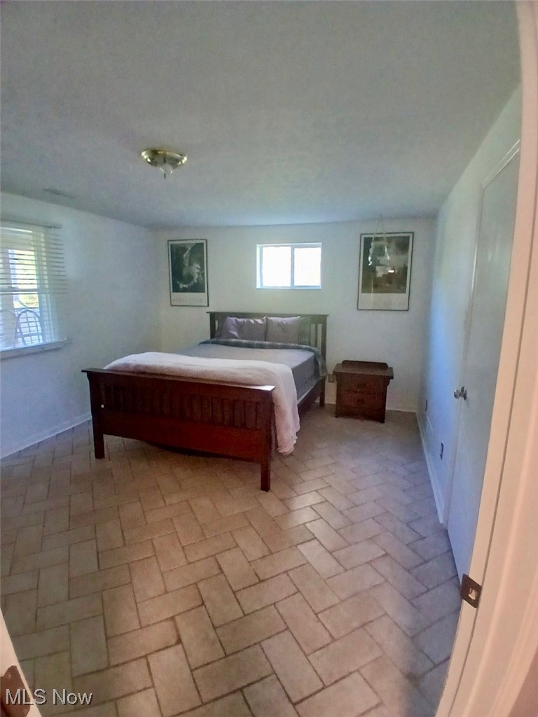 1685 Fattler Ridge Road Philo, OH 43771 - Photo 16 of 24 Bedroom with brick patterned floors