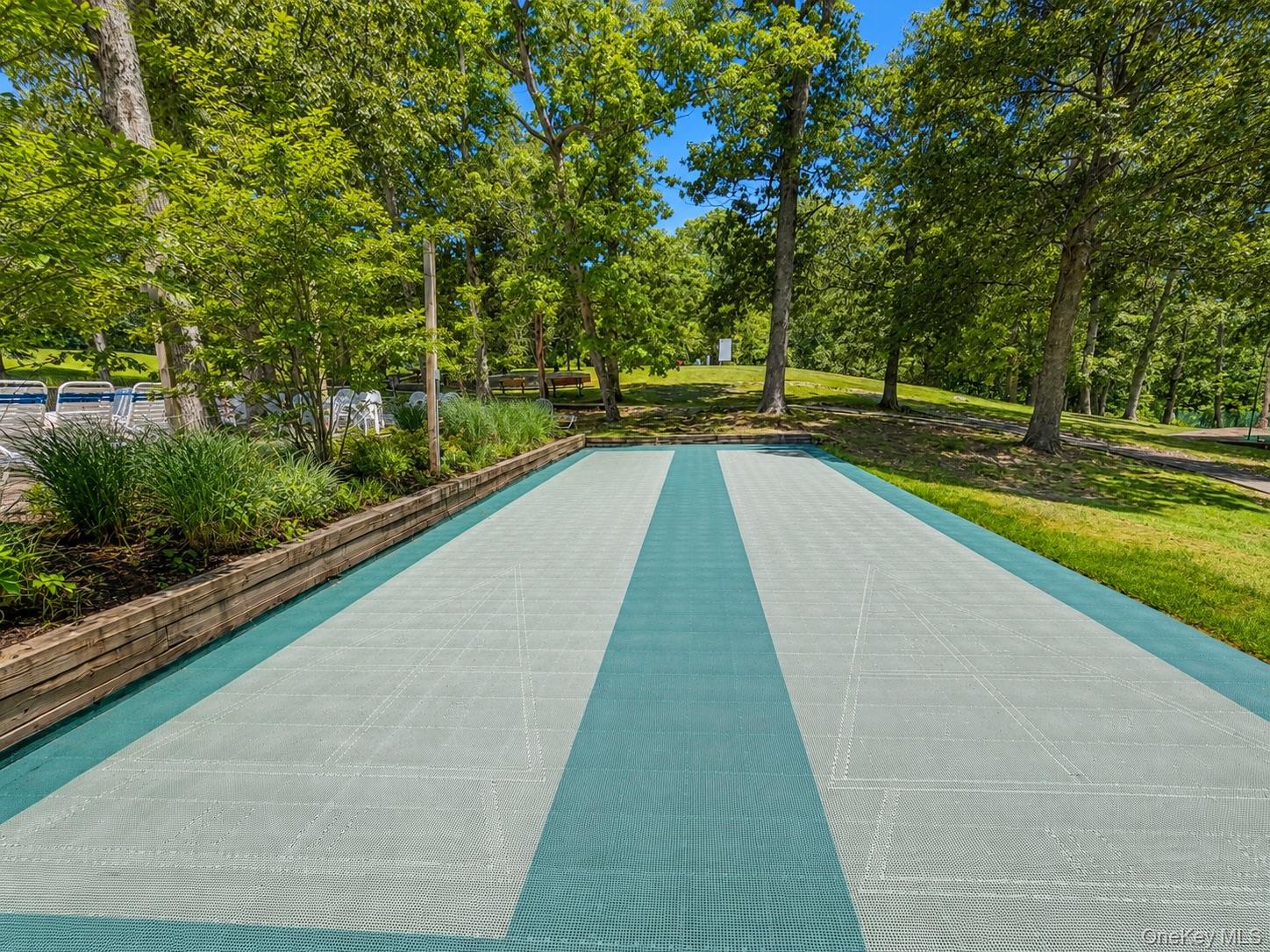 201 Birchwood Road, Unit 201 Coram, NY 11727 - Photo 24 of 27 a view of swimming pool with a yard