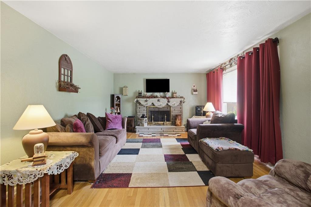 1705 Arona Road Irwin, PA 15642 - Photo 4 of 31 Lovely living area with a wood burning fireplace