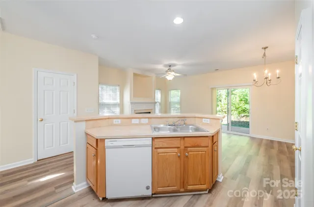a view of a kitchen counter space and wooden floor