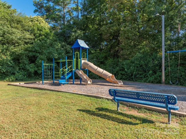 a view of a park with a slide