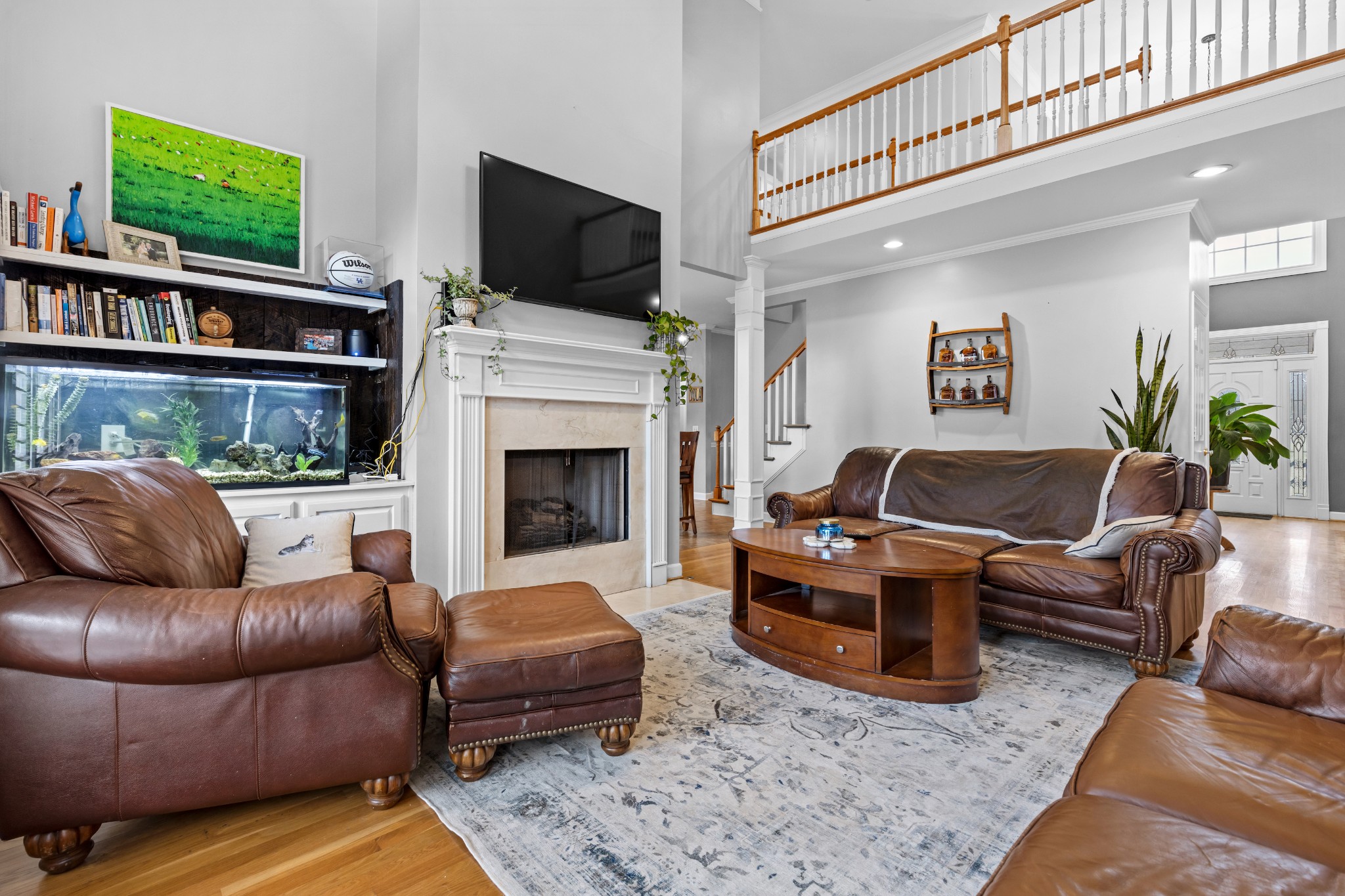 3354 Old Franklin Road Antioch, TN 37013 - Photo 17 of 46 a living room with furniture a flat screen tv and a fireplace