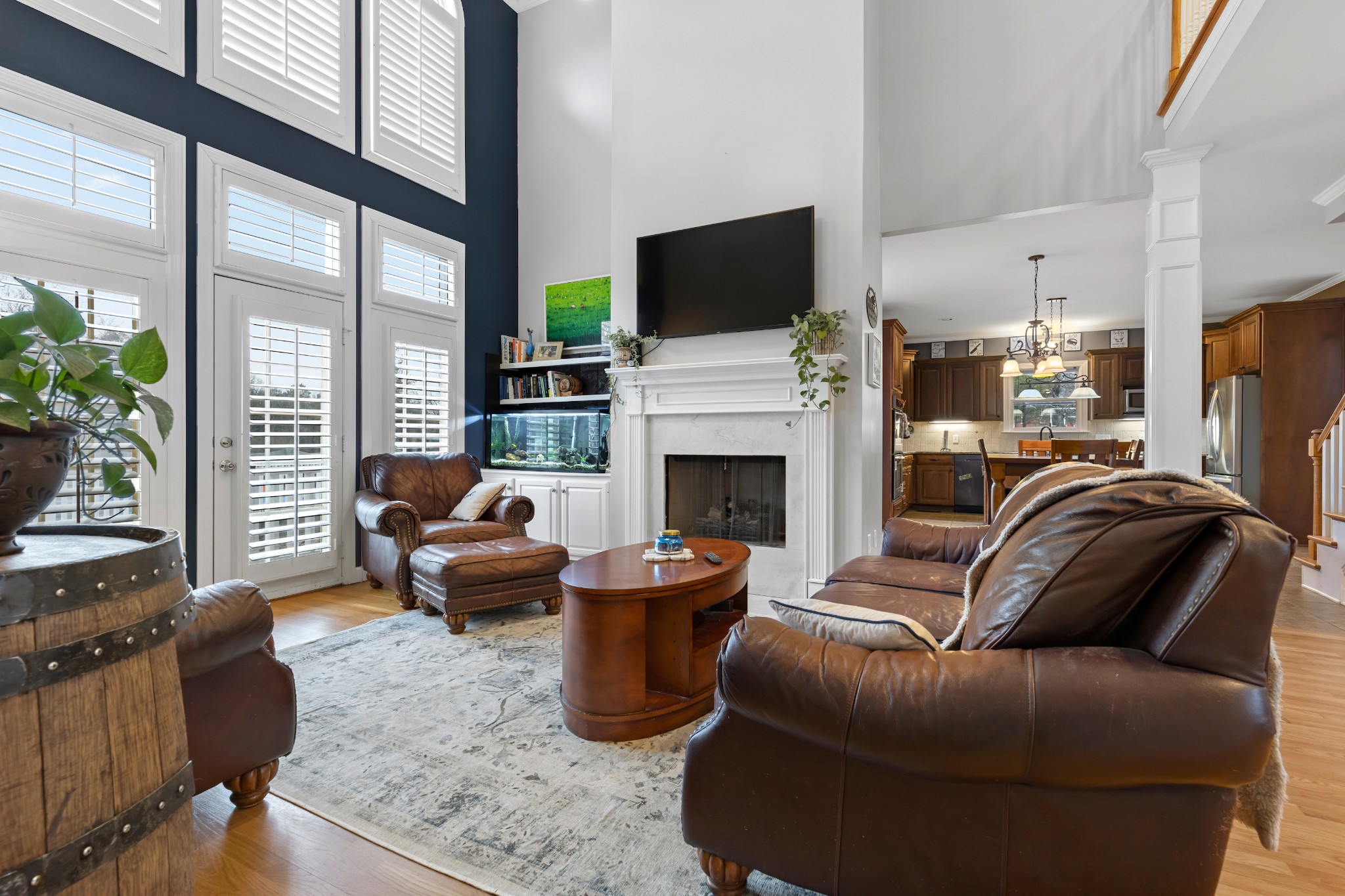 3354 Old Franklin Road Antioch, TN 37013 - Photo 18 of 46 a living room with furniture a fireplace and a flat screen tv