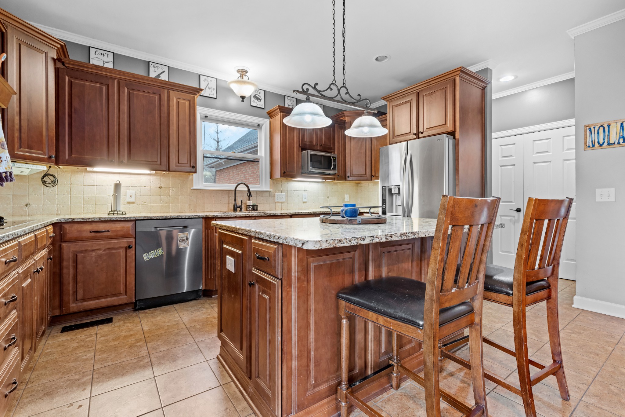 3354 Old Franklin Road Antioch, TN 37013 - Photo 25 of 46 a kitchen with stainless steel appliances granite countertop a stove a sink dishwasher and a refrigerator