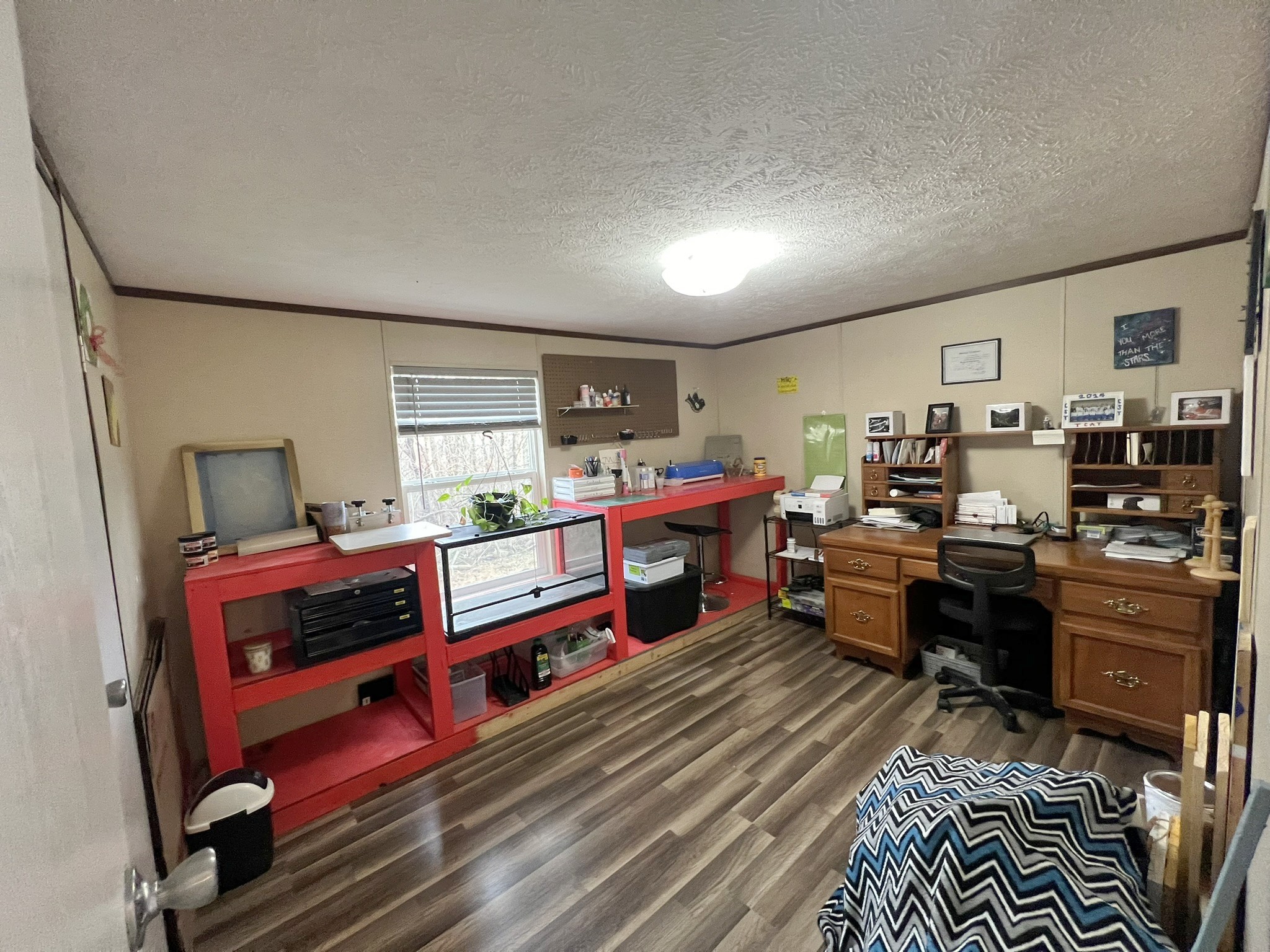 1902 B Dodson Road Columbia, TN 38401 - Photo 12 of 24 a room with furniture a flat screen tv and a book shelf