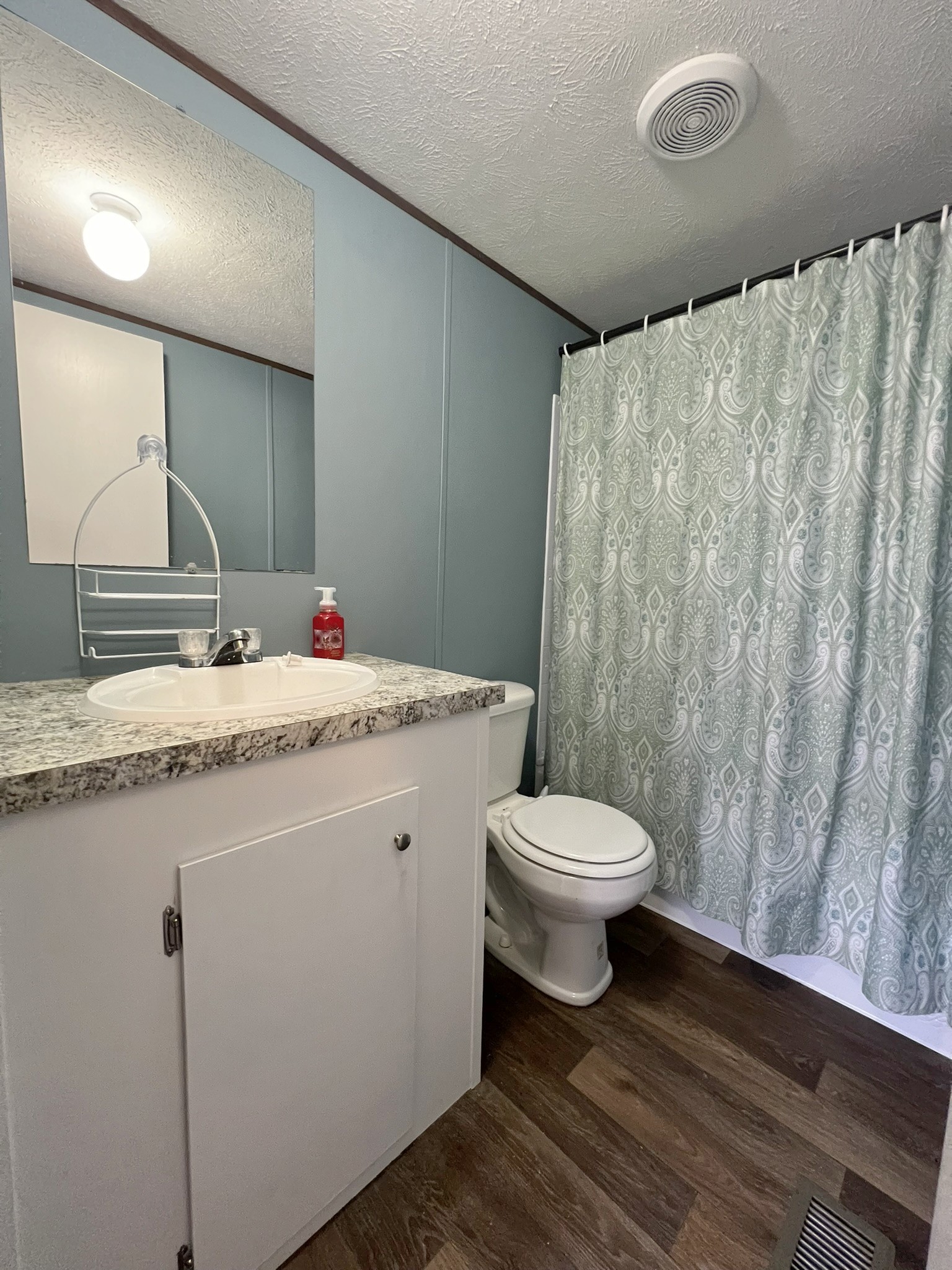 1902 B Dodson Road Columbia, TN 38401 - Photo 13 of 24 a bathroom with a granite countertop sink toilet and a mirror