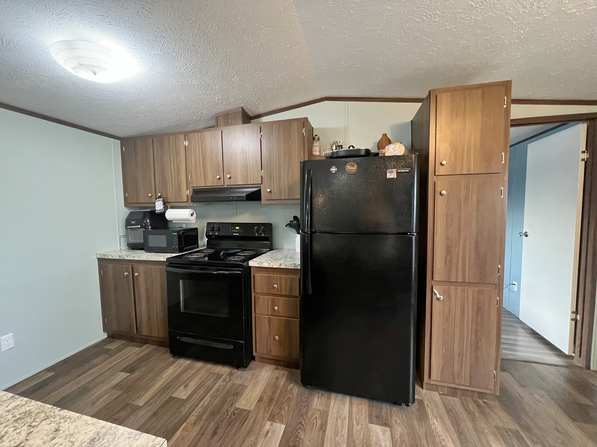 1902 B Dodson Road Columbia, TN 38401 - Photo 4 of 24 a kitchen with a refrigerator cabinet and a sink