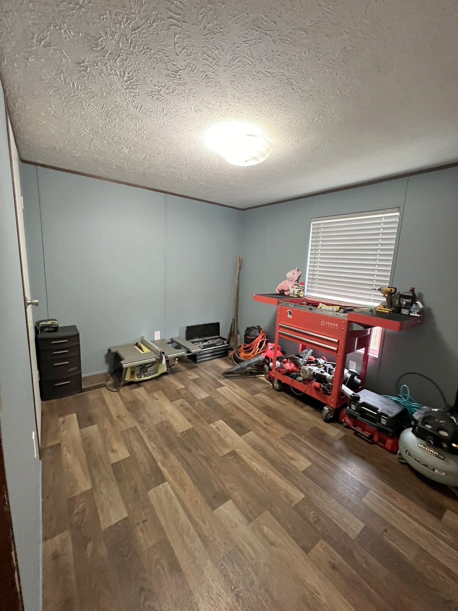 1902 B Dodson Road Columbia, TN 38401 - Photo 10 of 24 a bedroom with a bed and a chandelier