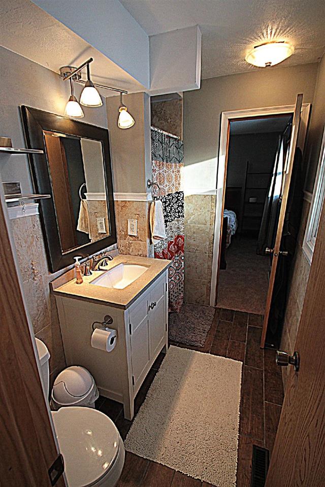 2911 Karr Road Belvidere, IL 61008 - Photo 15 of 19 a bathroom with a sink a toilet and mirror