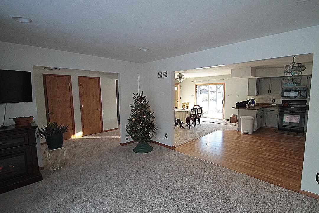 2911 Karr Road Belvidere, IL 61008 - Photo 6 of 19 a living room with furniture and a flat screen tv