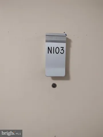 a view of a street with a large trees