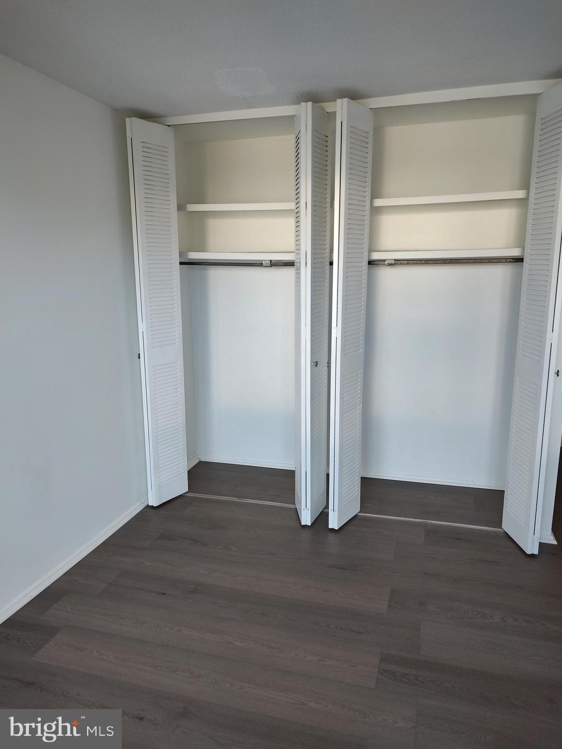 1301 Delaware Avenue Southwest, Unit N103 Washington, DC 20024 - Photo 11 of 26 a view of an empty room with wooden floor
