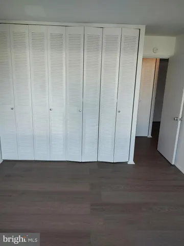 an empty room with wooden floor