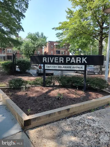 a view of porch with a floor to ceiling window and wooden floor