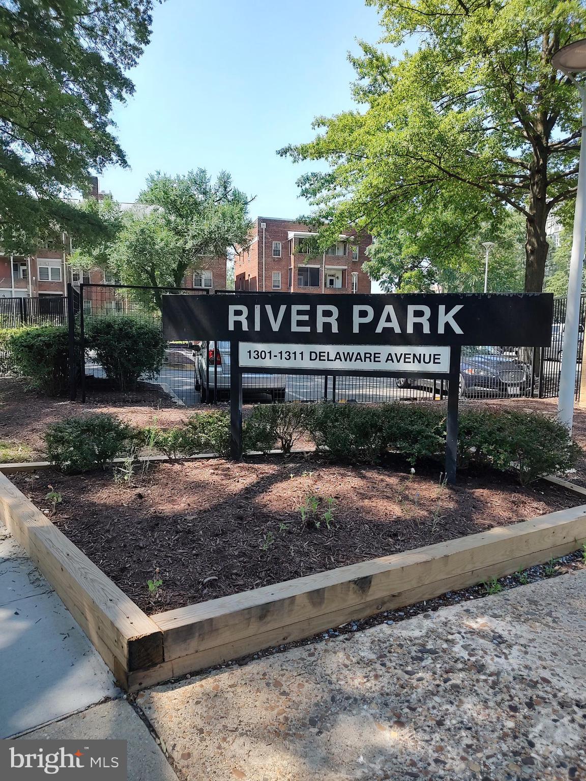 1301 Delaware Avenue Southwest, Unit N103 Washington, DC 20024 - Photo 2 of 26 a view of a street with a large trees