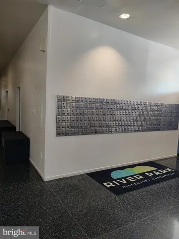 a lobby with furniture and wooden floor