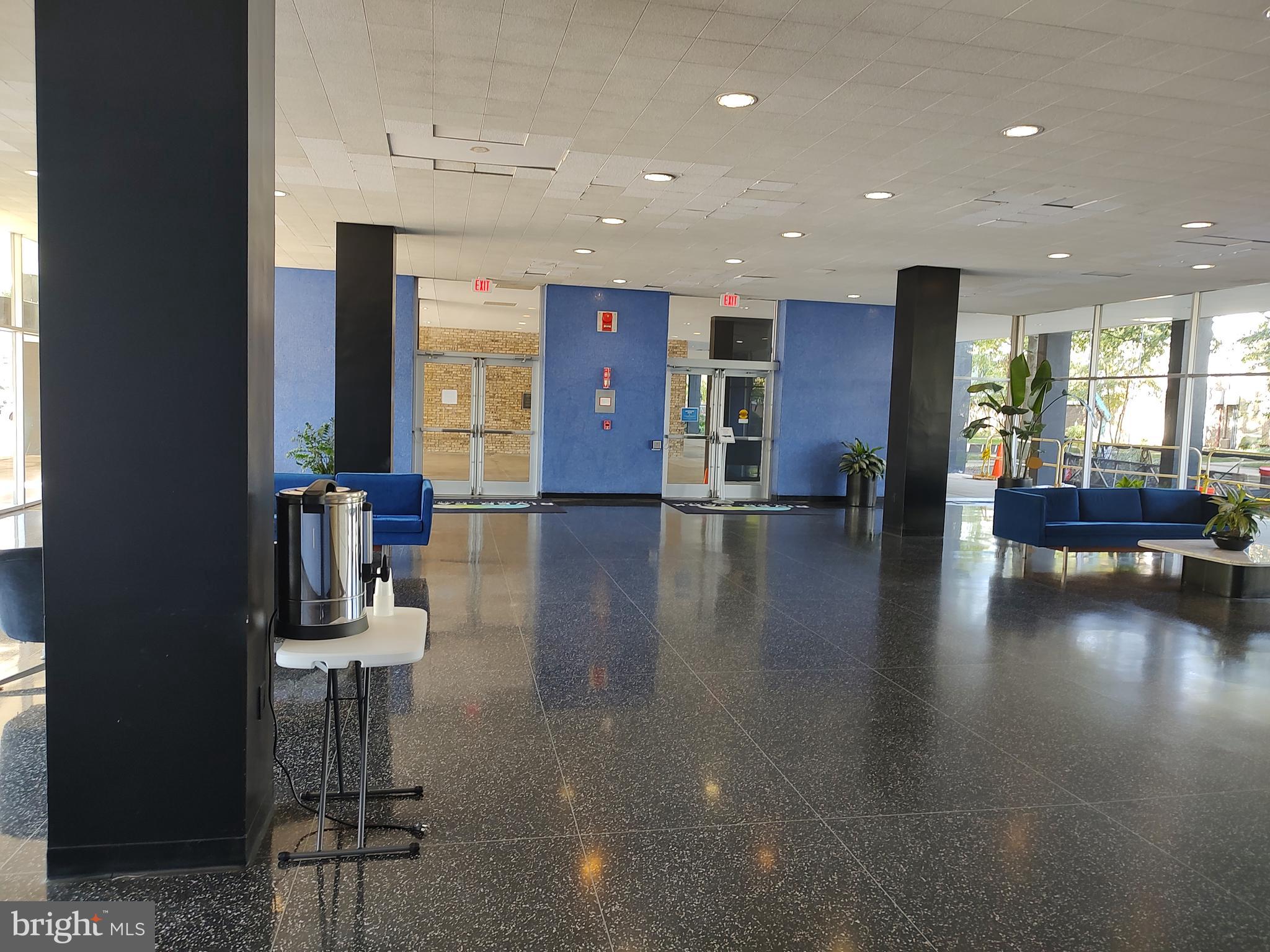 1301 Delaware Avenue Southwest, Unit N103 Washington, DC 20024 - Photo 24 of 26 a lobby with furniture and wooden floor