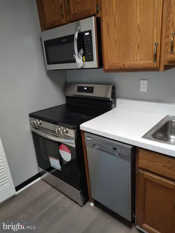 a kitchen with a refrigerator and cabinets