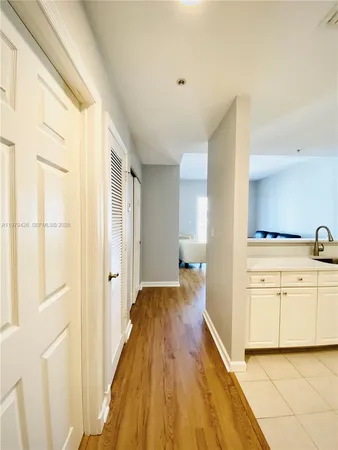 a kitchen with stainless steel appliances a sink stove and refrigerator