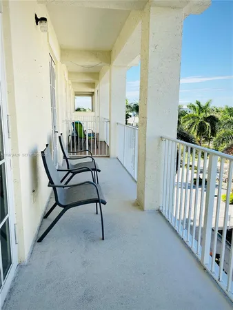 a front view of a house with outdoor seating