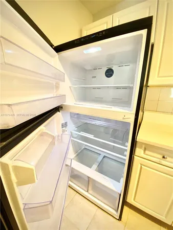a stove top oven sitting inside of a kitchen