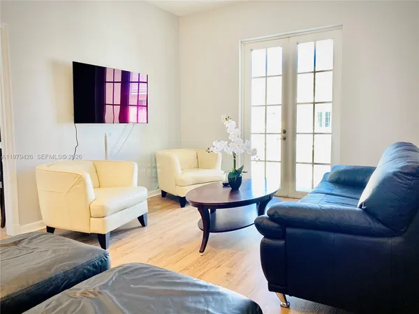 a living room with furniture and a window