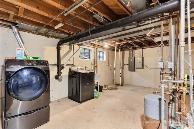 an aerial view of a house with a yard swimming pool and outdoor seating