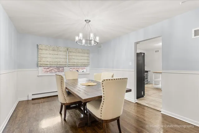 a bathroom with a granite countertop sink a toilet and a mirror
