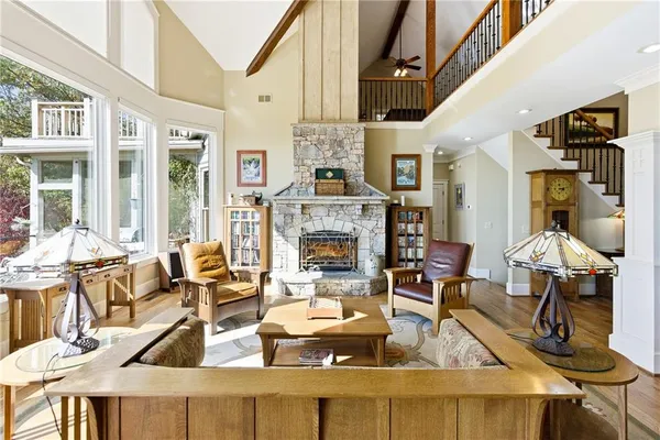 a large kitchen with a large window and stainless steel appliances