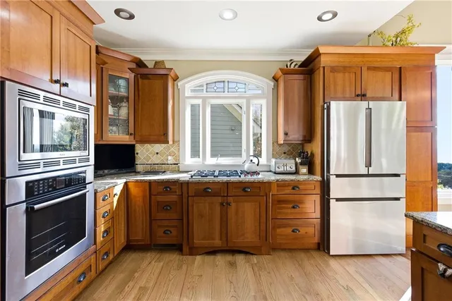 a spacious bathroom with a granite countertop sink mirror and shower