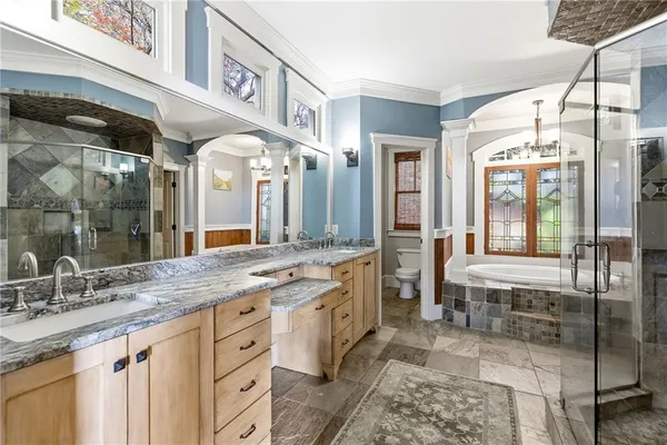 a bath tub sitting in a bathroom next to a window