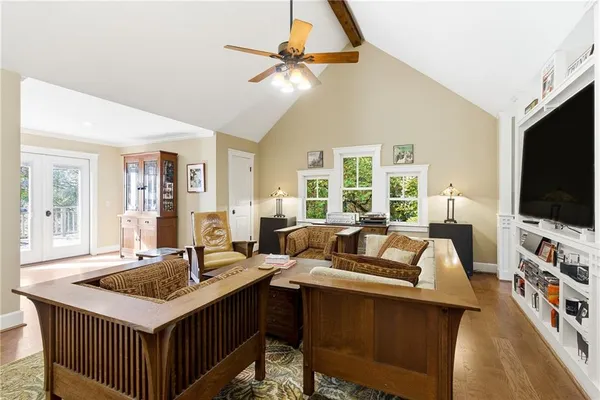 a view of a house with wooden fence