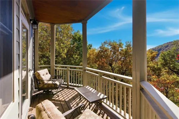 a view of a balcony with furniture