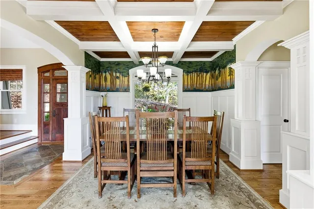 a living room with fireplace furniture and a large window