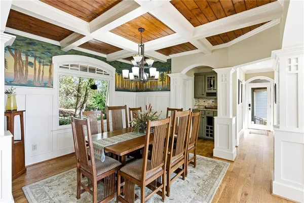 a view of a dining room with furniture and chandelier