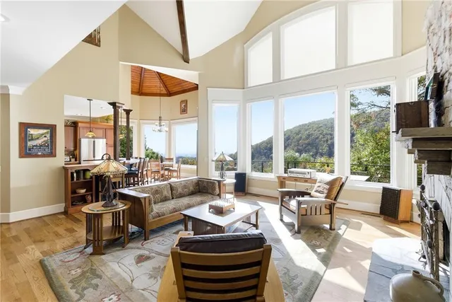 a large kitchen with a large window and stainless steel appliances