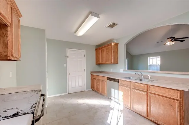 a spacious bathroom with a sink and a mirror