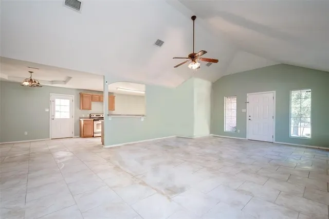 a view of an empty room with a window