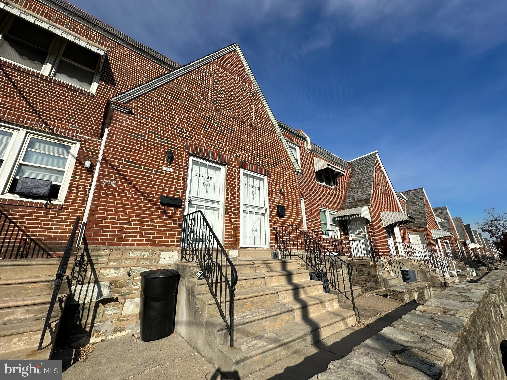 517 East Tabor Road, Unit 2 Philadelphia, PA 19120 - Photo 1 of 23 a front view of a house with a yard