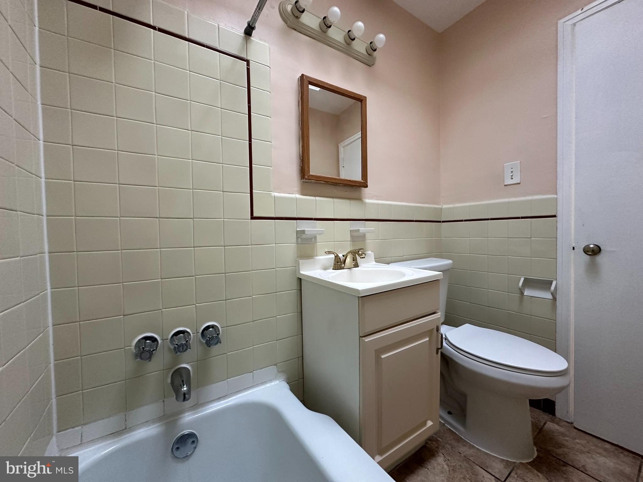 517 East Tabor Road, Unit 2 Philadelphia, PA 19120 - Photo 22 of 23 a bathroom with a sink toilet and shower