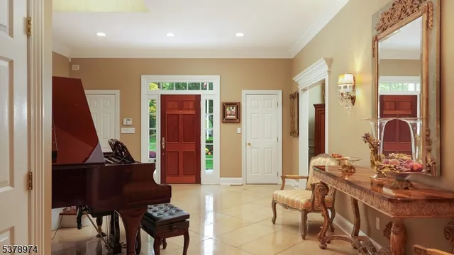 a view of a dining room with furniture and chandelier