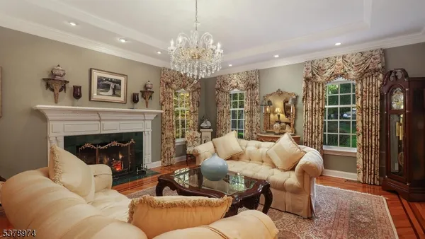 a kitchen with stainless steel appliances granite countertop a sink a stove and a wooden floors