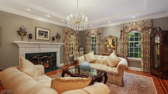 a kitchen with stainless steel appliances granite countertop a sink a stove and a wooden floors