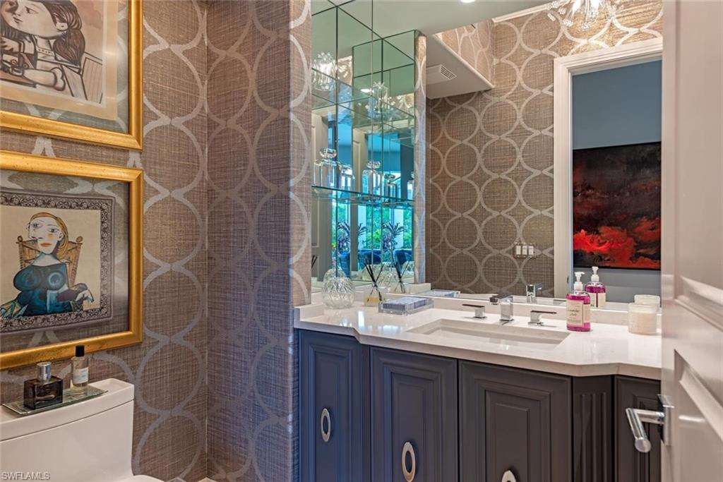 2701 Buckthorn Way Naples, FL 34105 - Photo 24 of 48 a bathroom with a sink and a mirror