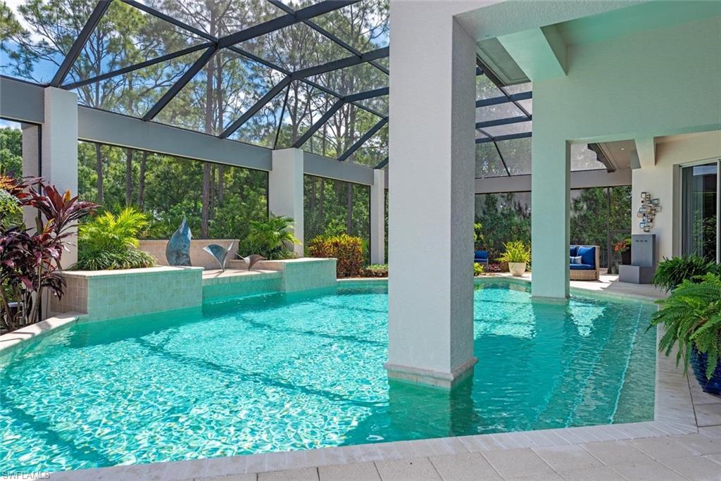 2701 Buckthorn Way Naples, FL 34105 - Photo 29 of 48 a view of a house with backyard sitting area and garden